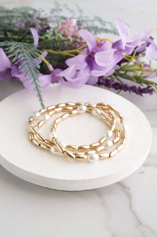 Gold tone and pearls beaded bracelet stack