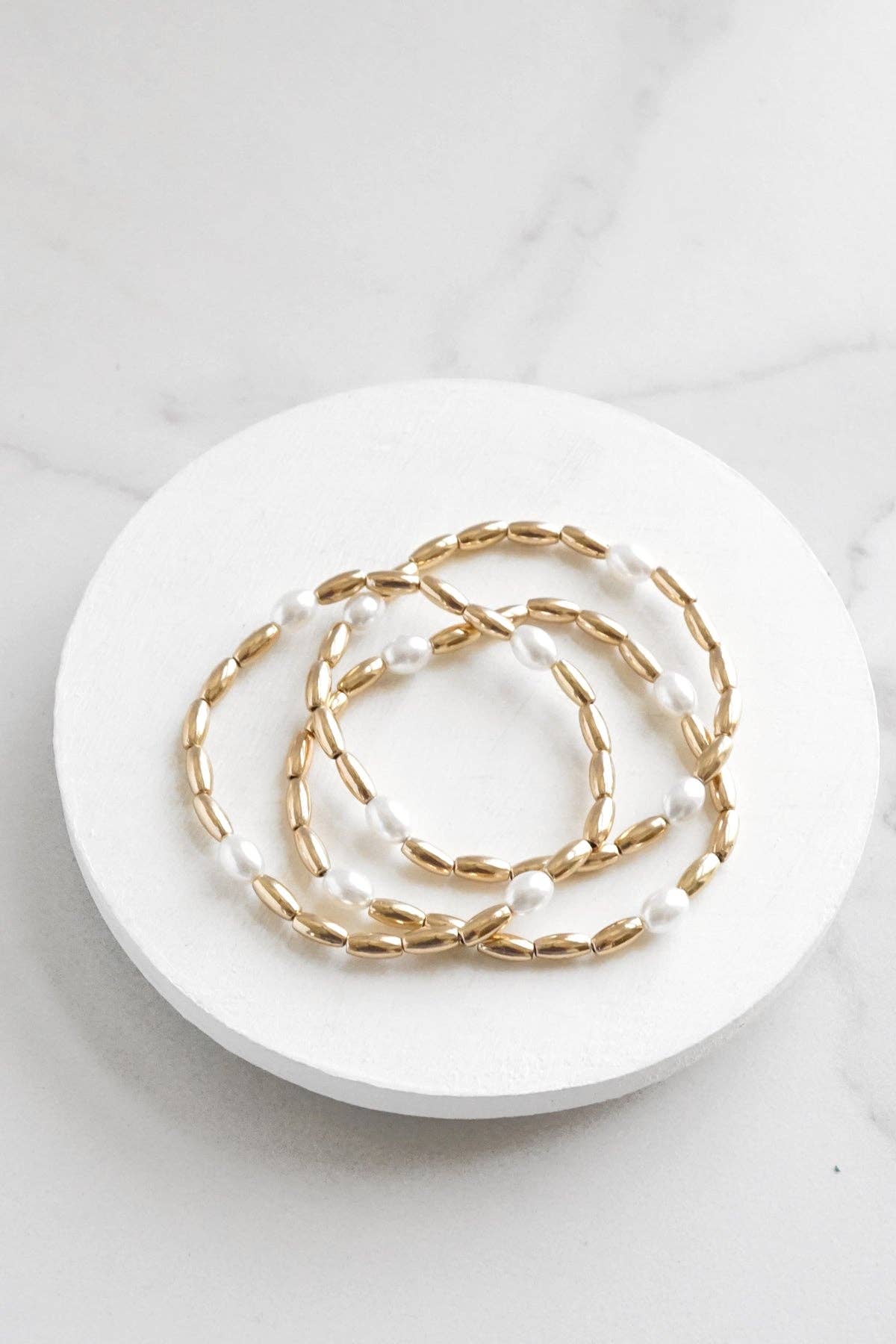 Gold tone and pearls beaded bracelet stack